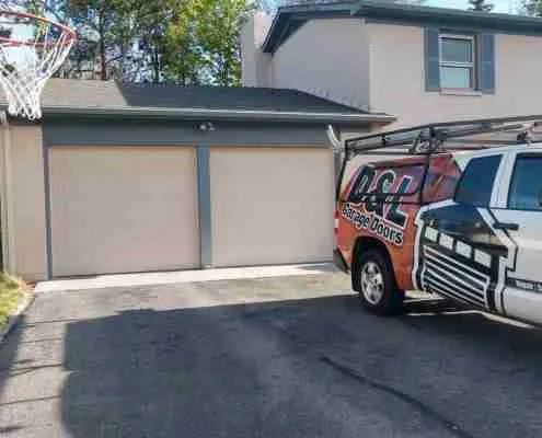Old tan garage doors before D&L service