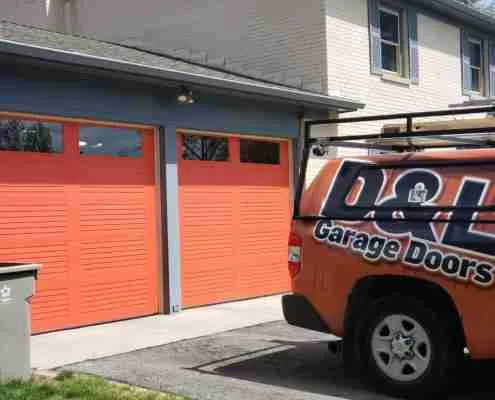 New red garage doors after D&L installation